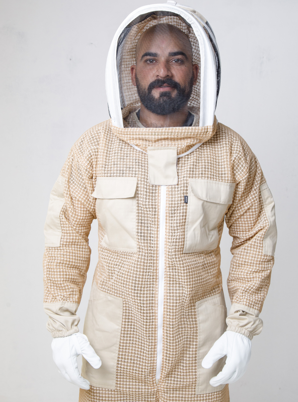 Beekeeper dressed in an Apiarist TripleGuard Coverall equipped with Gloves and a Fencing Veil