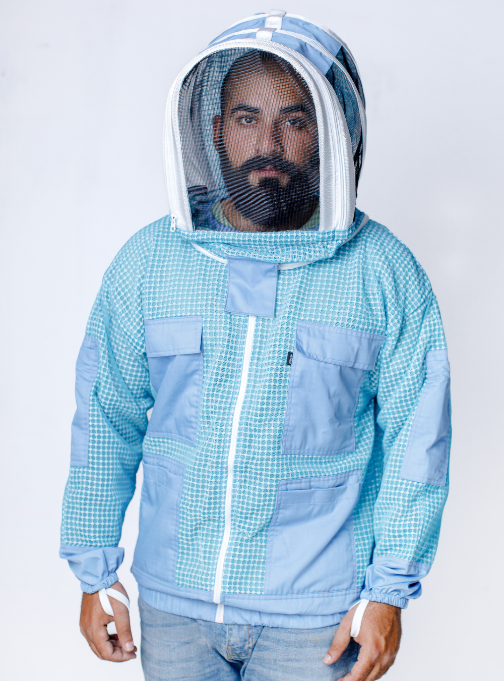 A light blue AquaMesh Jacket with mesh hood and secure front pockets.