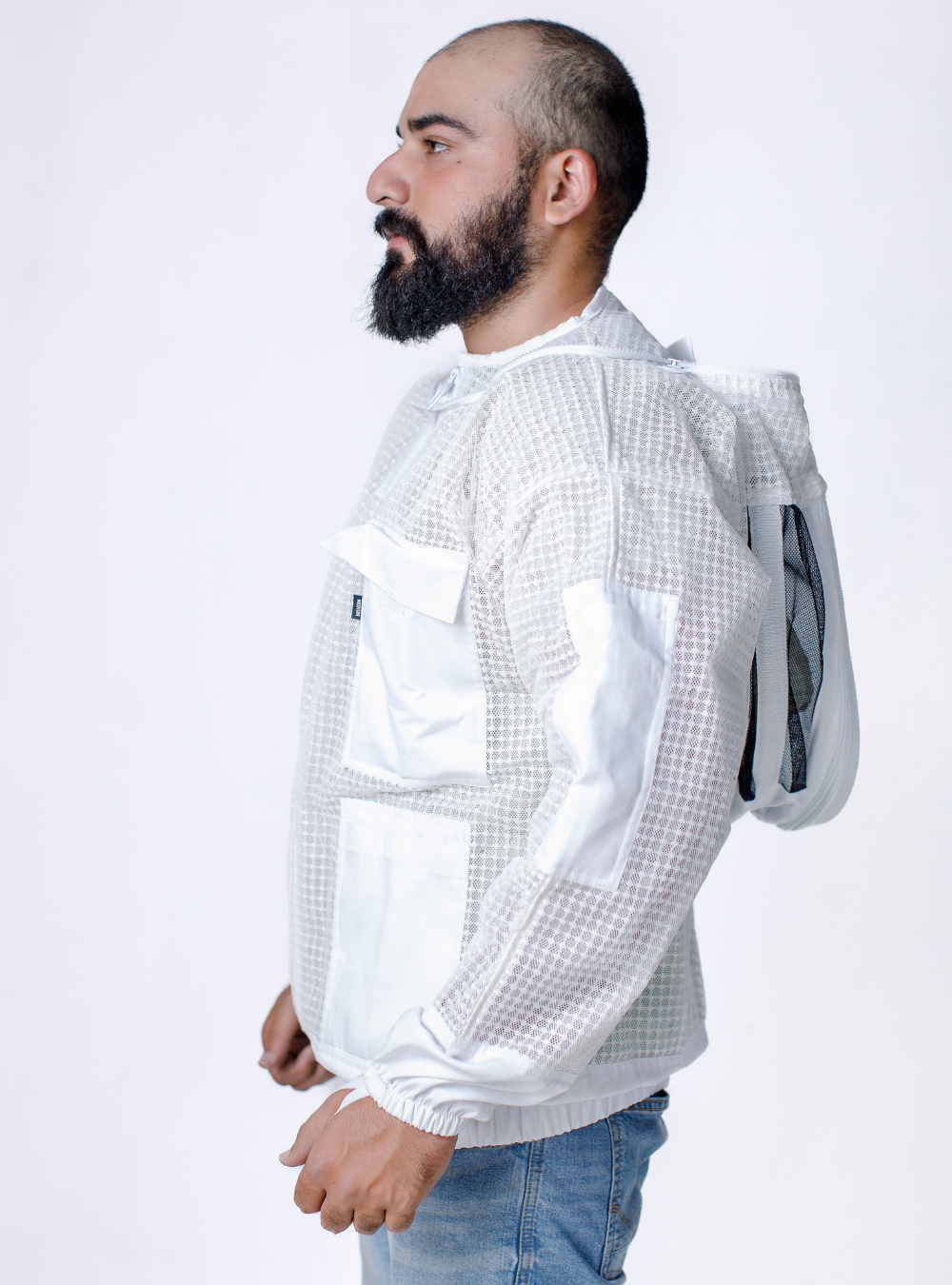 A 3 layer ventilated 'Ultra Breeze Beekeeping Jacket with Veil' for beekeeping with detachable Fencing Veil and ample storage pockets Side Look