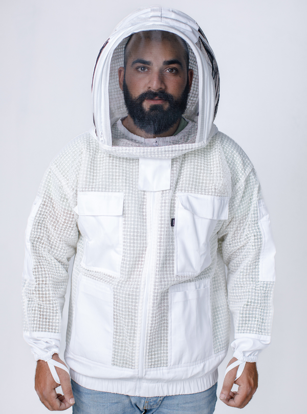 Man wearing a three-layer ventilated 'BeeAir White Jacket' for beekeeping, with a mesh hood and ample storage pockets.