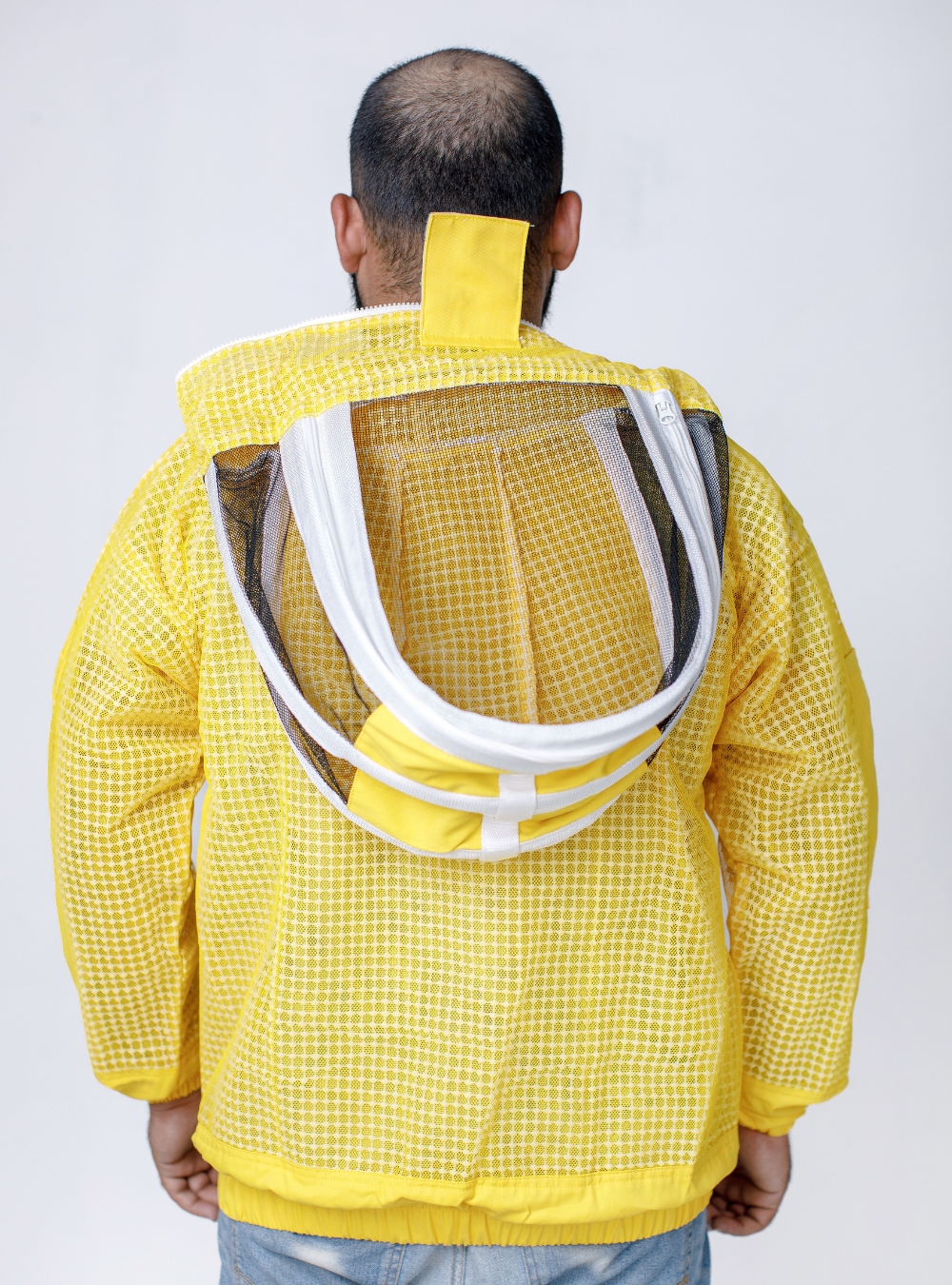 A back view of Golden Hive Guardian Beekeeping Jacket for beekeeping, with a detachable Fencing Veil and ample storage pockets.
