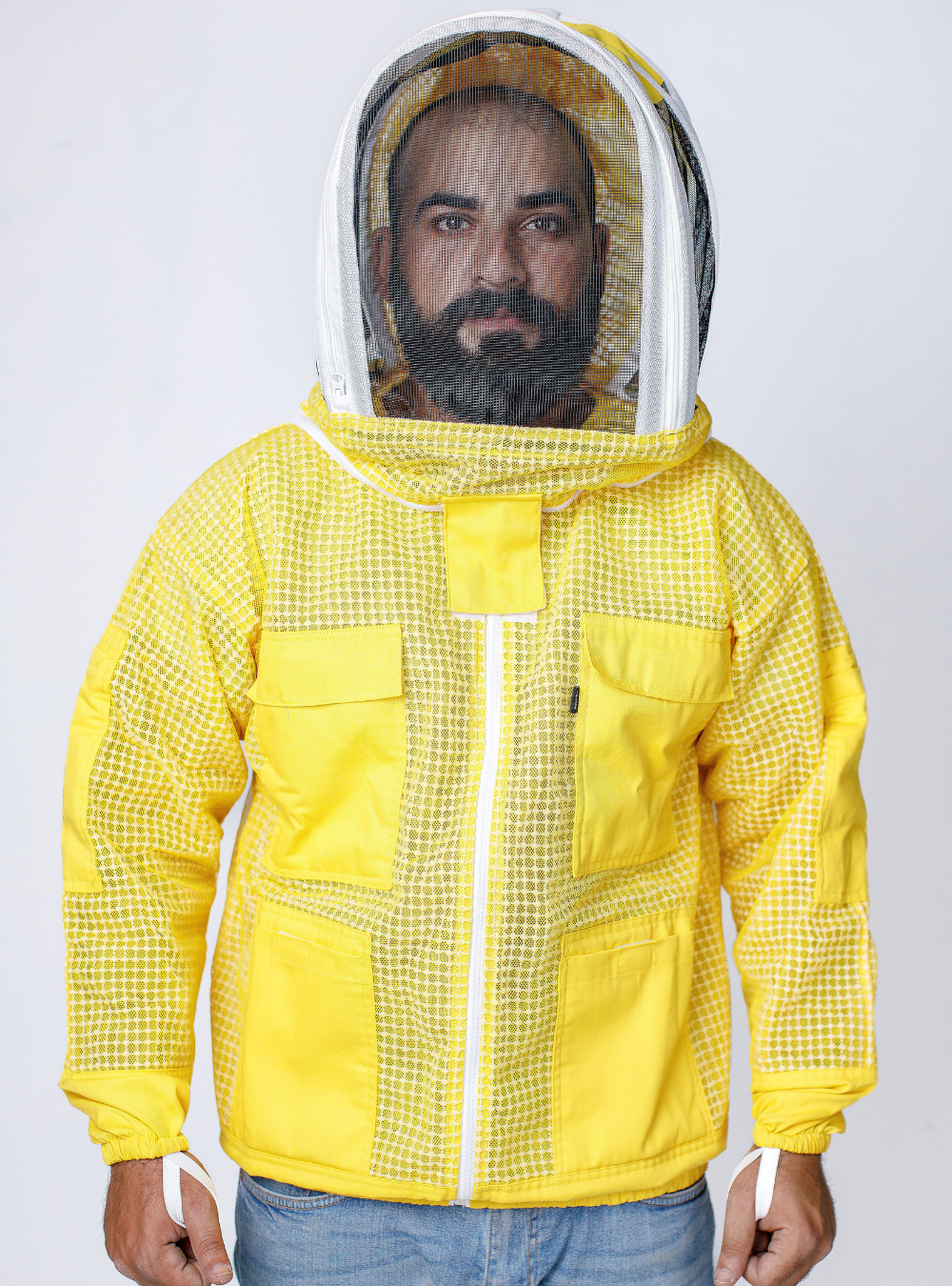 Man wearing Golden Hive Guardian Beekeeping Jacket' for beekeeping, complete with a mesh hood and ample storage pockets