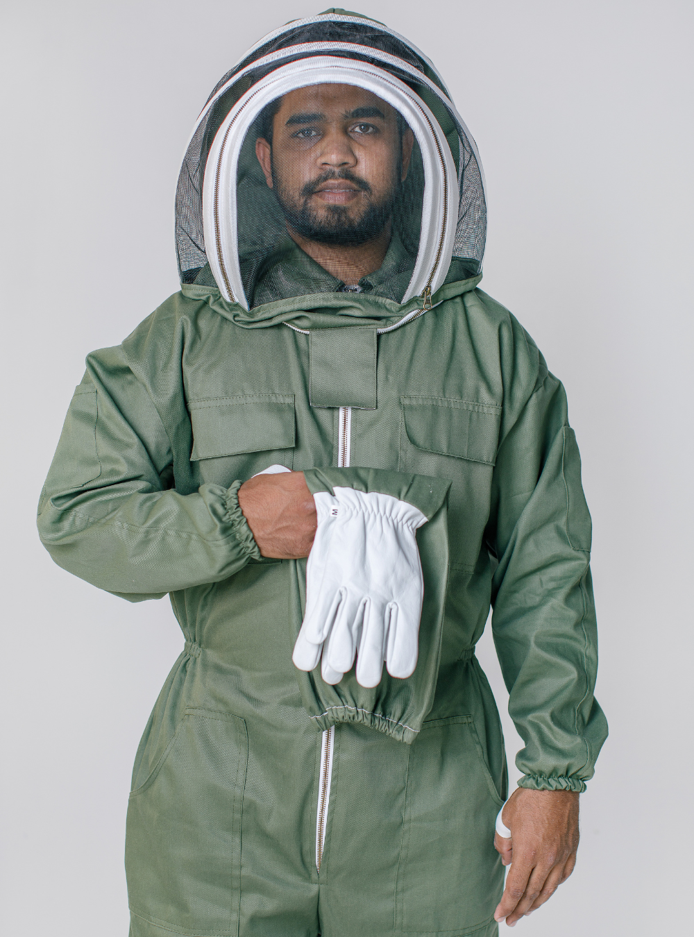 A man in OliveGuard Fencing Veil Suit showcasing Goatskin Gloves.