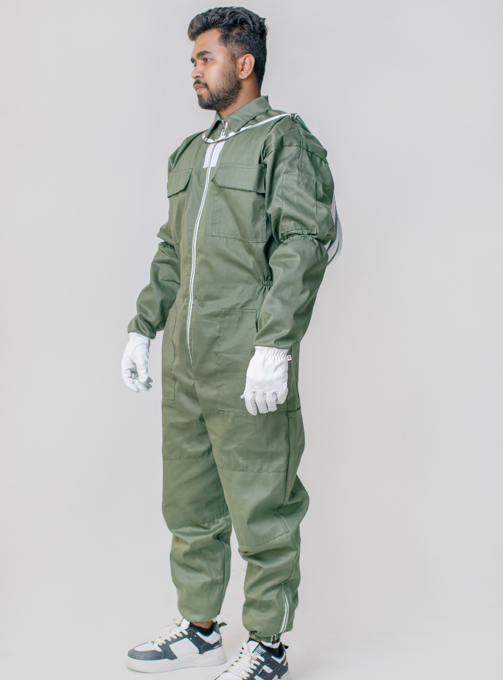 A side profile of OliveGuard Fencing Veil Suit featured a detachable Veil, Goatskin Gloves, breathable fabric, and a secure zippered closure for safety.