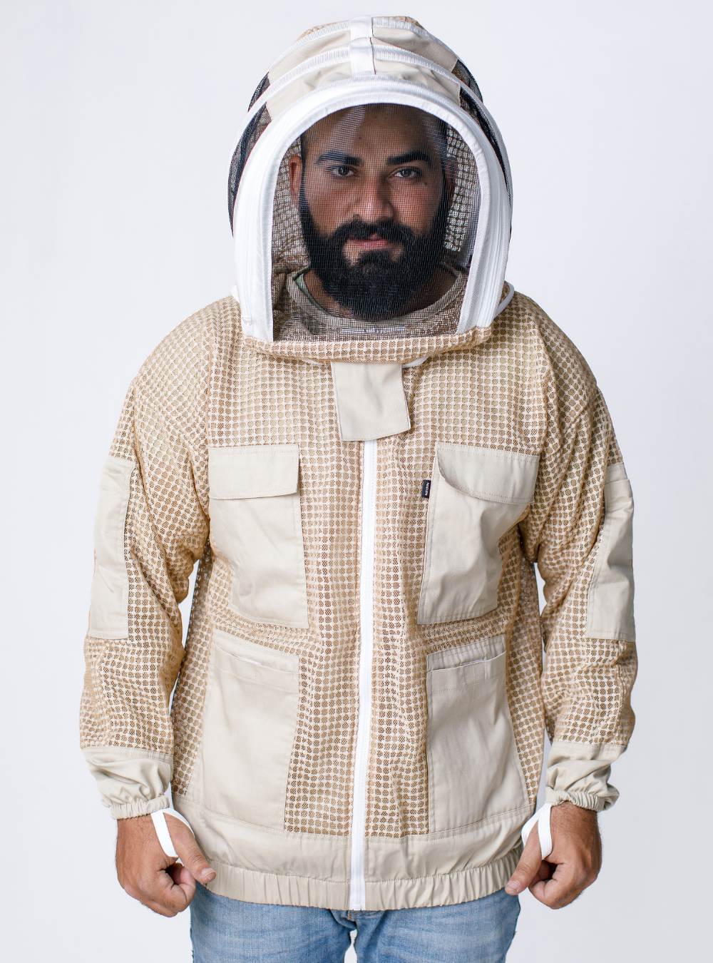Man in a Triple Vent-Armor Beekeeping Jacket featuring Fencing veil, elastic cuffs, triple-layer ventilation for enhanced airflow, ensuring cool and comfortable wear during beekeeping tasks.