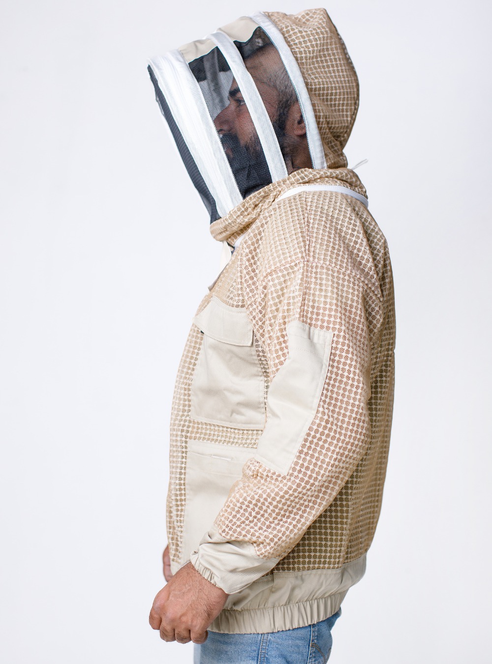 A side profile of  Triple Vent-Armor Beekeeping Jacket featuring amble pockets, elastic cuffs, and a hood with a wide-angle mesh face shield, enhancing visibility and breathability.