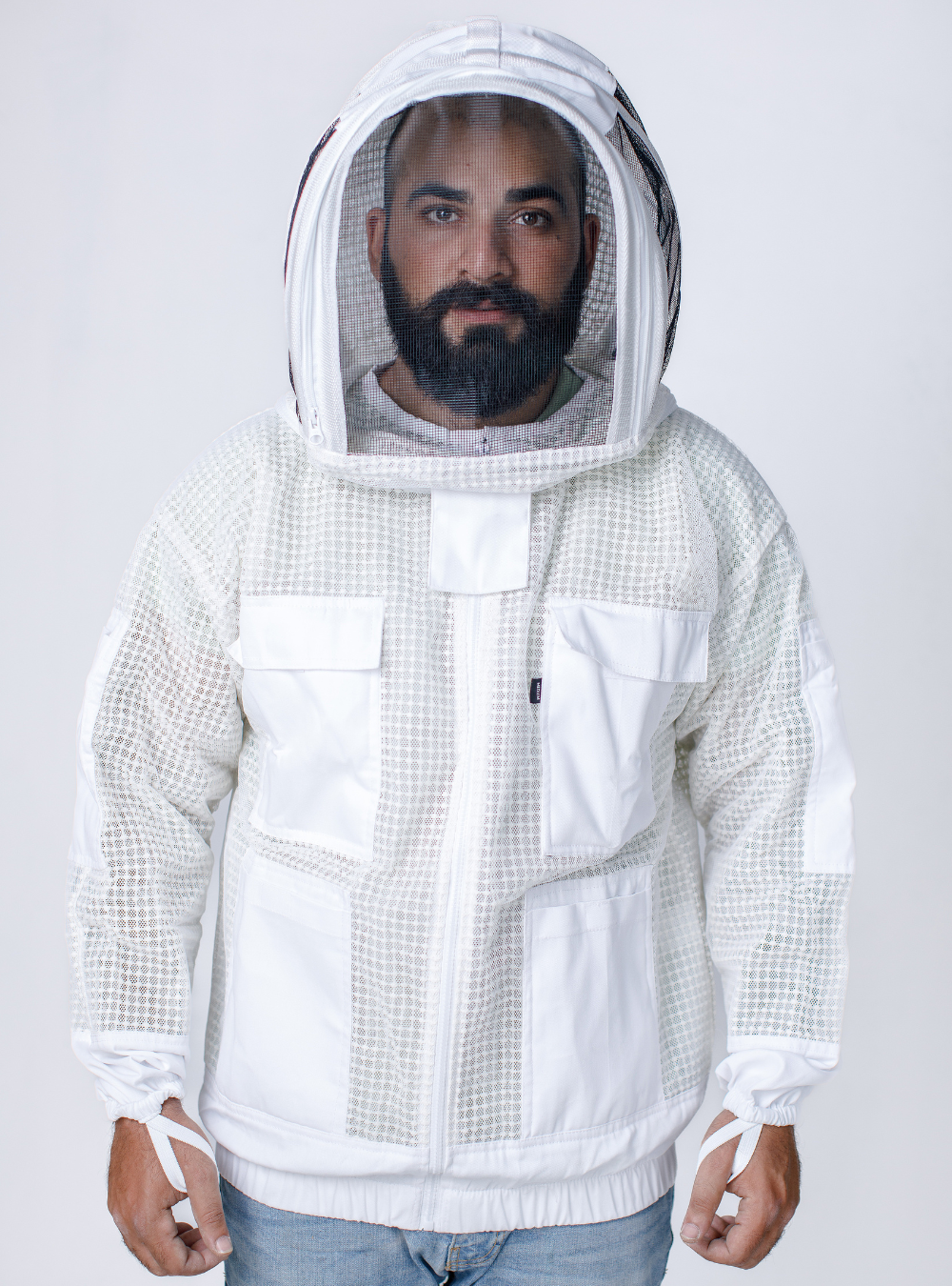 Man wearing a three-layer ventilated 'Ultra Breeze Beekeeping Jacket with Veil' for beekeeping, with a mesh hood and ample storage pockets.