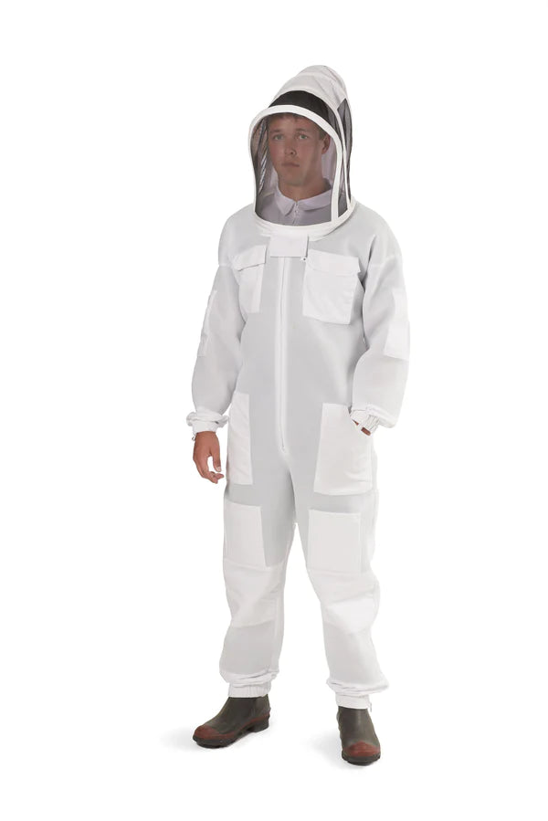 Full-body shot of a beekeeper dressed in a high-protection 3 Layer Ventilated Bee Suit incorporating a Fencing Vail, and double-stitched construction for durability.