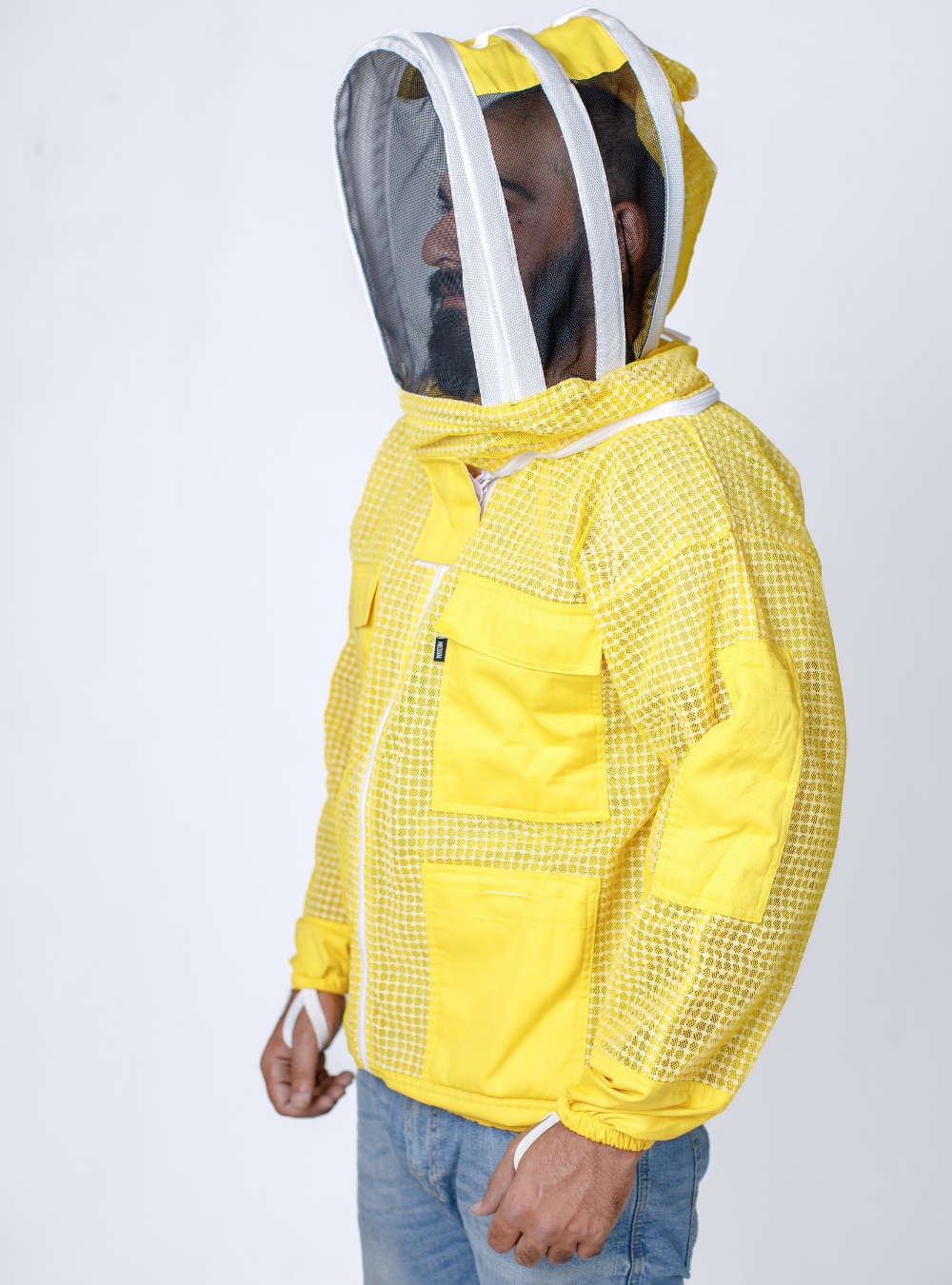 A side profile of Yellow Beekeeping Ventilated Jacket incorporating a Fencing Vail, multiple pockets, and double-stitched construction for durability.