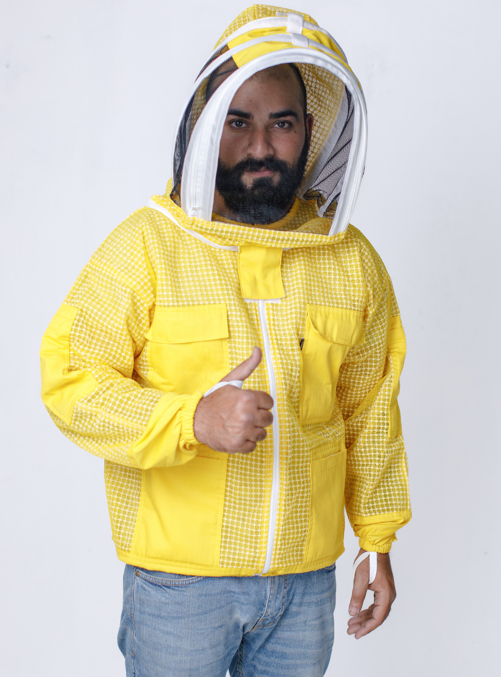 Beekeeper is wearing Stylish yet functional Yellow Beekeeping Ventilated Jacket incorporating a Fencing Vail, multiple pockets, and double-stitched construction for durability.